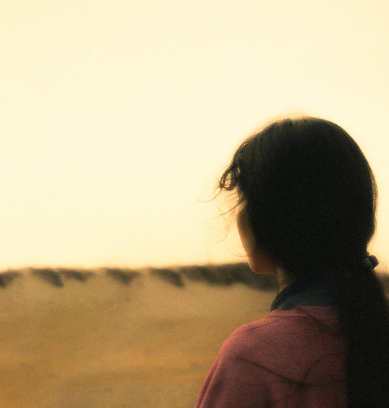 back view of a woman standing outside